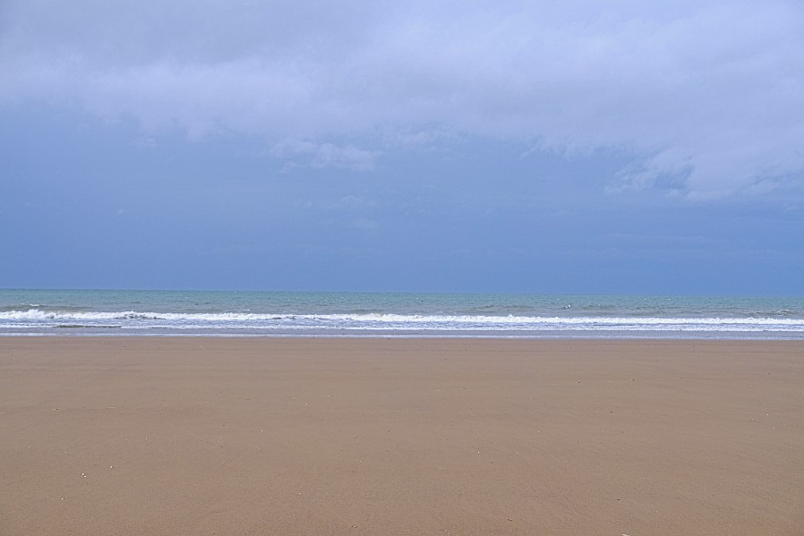 photo of sandy beach, waves and sky
